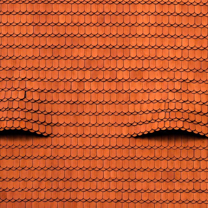 A cool background of an old red roof with interesting textures