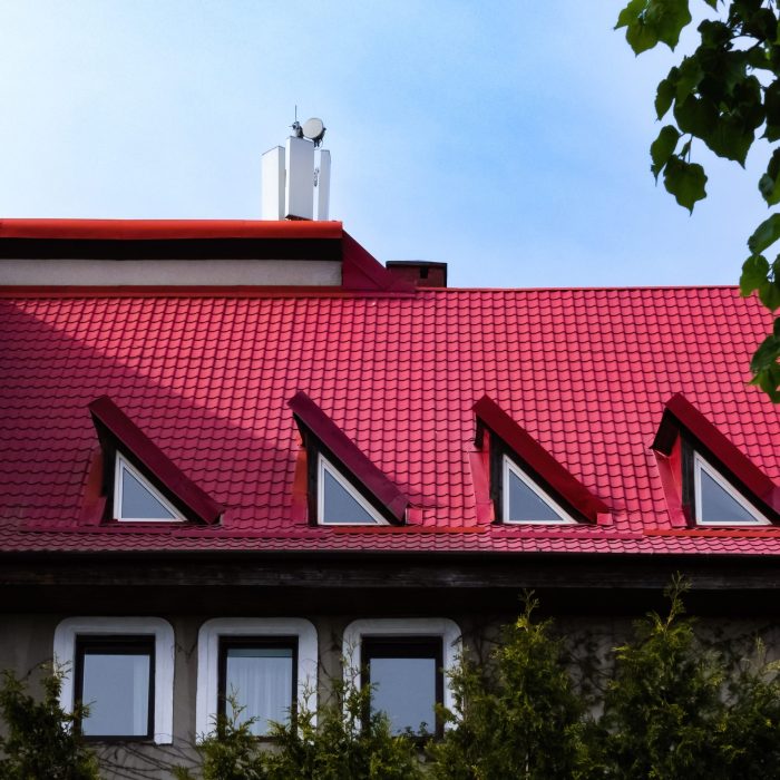 red tiled roof with triangular windows